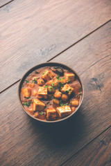 Chole Paneer curry made using boiled chickpea with cottage cheese with spices. Popular North Indian recipe. served in a bowl or serving pan. Selective focus