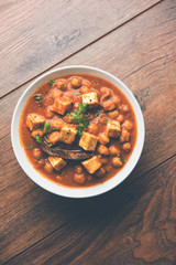Chole Paneer curry made using boiled chickpea with cottage cheese with spices. Popular North Indian recipe. served in a bowl or serving pan. Selective focus