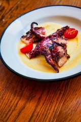 Mediterranean Octopus with vegetables and potatoes