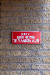 Gouda, South-Holland/The Netherlands - October 27 2018: Little wall sign stating people cannot park their bikes there
