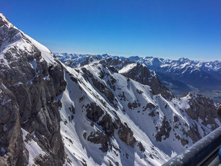 Ramsau am Dachstein, Steiermark/Austria - April 11 2016: Views from the Dachstein Glacier shot from the suspension bridge close up on rock facing