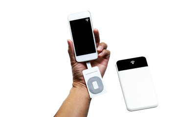 a hand of a man holding white smartphone with wireless charging receiver tool at charge slot and a sign of wireless charging mode with the power bank on white  background isolated