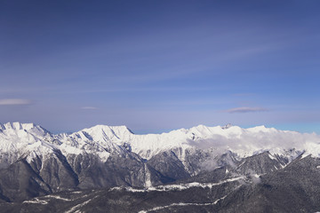 Fototapeta na wymiar snow mountains, blue sky winter ski resort