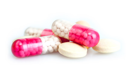 Fototapeta na wymiar multicolored pills on white background