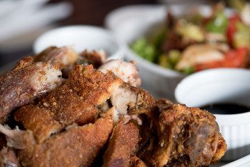Crispy fried pork leg placed on a plate