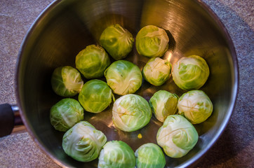 Brussel sprouts trimmed and prepared for cooking in a pan