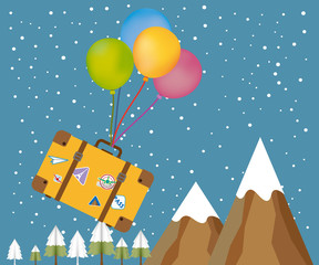 Fototapeta na wymiar Travel with luggage with balloon floating in a snowing day