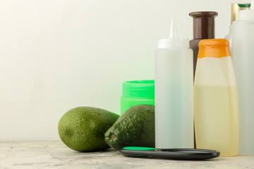 Various hair care products and various hair accessories on a light background. hair cosmetics.
