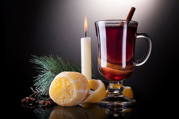 Mulled wine with cinnamon sticks and lemon