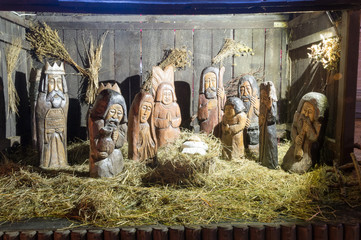 Carved wooden Nativity scene with Jesus at Christmas time.