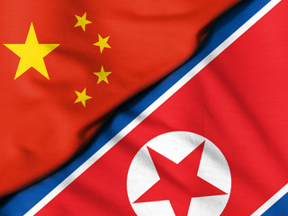 Crumpled flags. Flag of the People's Republic of China. Flag of North Korea.