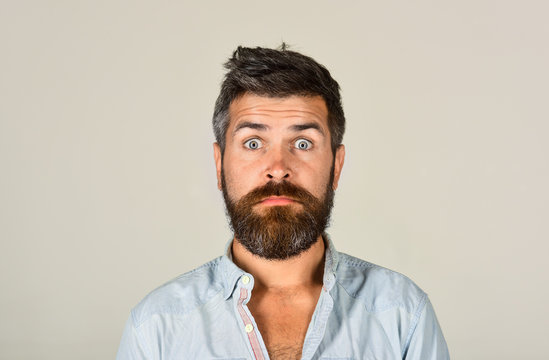 Bearded man looking skeptic raising eyebrows. Earnest expression. Thinking man with beard and mustache. Expressing distrust and strong confusion. Shocked man in casual clothes. Disbelief expression.