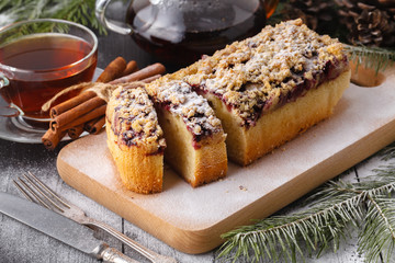 homemade galette with berries and walnuts on wooden rustic table