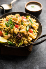 Kheema Pulao - Rice cooked with mutton or chicken mince with vegetables and spices. served in a bowl. selective focus