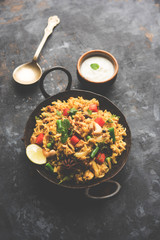 Kheema Pulao - Rice cooked with mutton or chicken mince with vegetables and spices. served in a bowl. selective focus