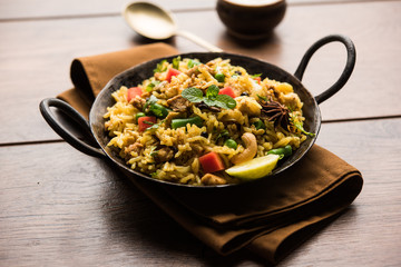 Kheema Pulao - Rice cooked with mutton or chicken mince with vegetables and spices. served in a bowl. selective focus