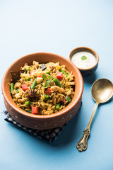 Kheema Pulao - Rice cooked with mutton or chicken mince with vegetables and spices. served in a bowl. selective focus