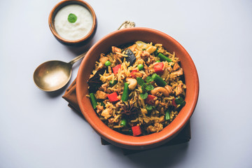 Kheema Pulao - Rice cooked with mutton or chicken mince with vegetables and spices. served in a bowl. selective focus