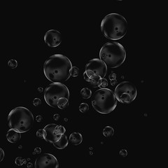 White air bubbles isolated on black background. Underwater oxygen. Soap closeup.