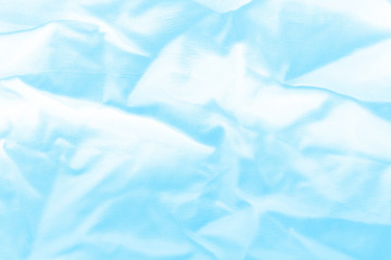 Ocean blue textile background. Silk cloth texture. Fabric jeans pattern.