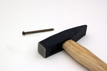 Close up of hammer and nails isolated on white background.
