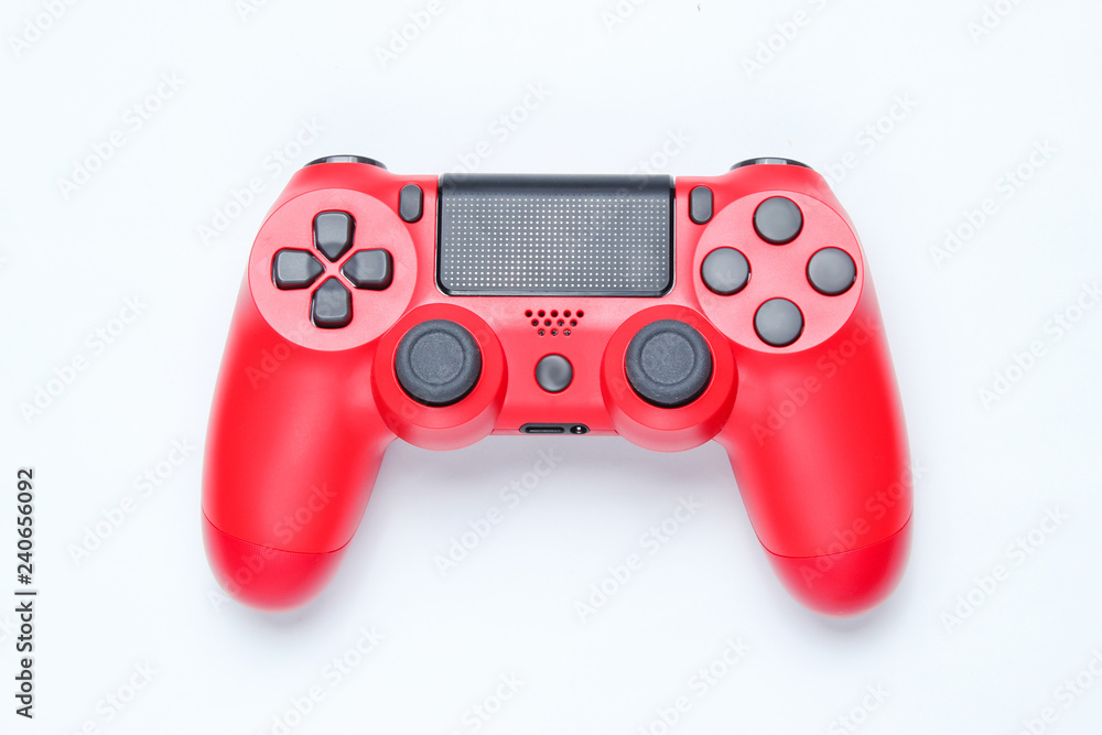 Wall mural modern red gamepad (joystick) on gray background. top view.