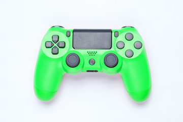 Modern green plastic gamepad (joystick) on gray background. Top view. © splitov27