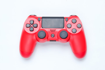 Modern red gamepad (joystick) on gray background. Top view. © splitov27