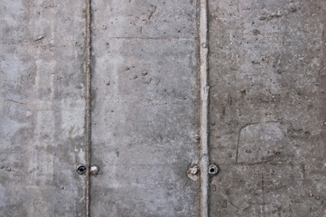 Concrete wall and armature at a construction site. Background.