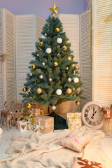 christmas tree with decorations and gifts