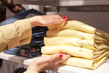 Beautiful woman shopping at fashionable shop
