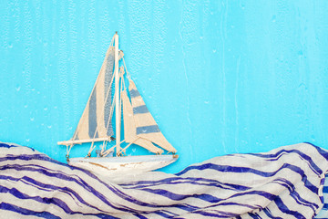 toy Sailing wooden ship yacht, the ship sails on a rainy day. imitation of waves.