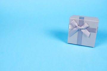 Fototapeta na wymiar Beautiful gift box on blue background.
