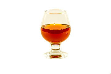 A glass of whiskey with ice or brandy and a square carafe isolated on a white background. Whiskey...