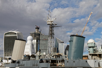 View to the city through chimney of a military boat - London, UK