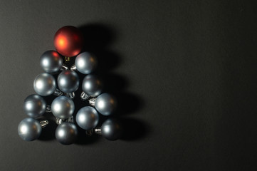 Christmas baubles creative decoration concept of Christmas tree with the black background