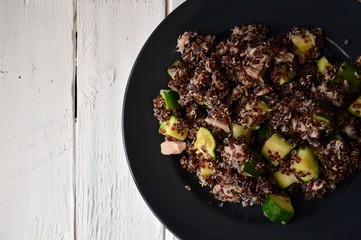 Healthy plate: red quinoa with zucchini and tuna, complete dish with all macronutrients