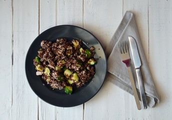 Healthy plate: red quinoa with zucchini and tuna, complete dish with all macronutrients