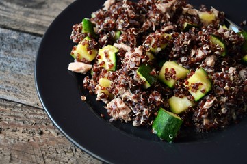 Healthy plate: red quinoa with zucchini and tuna, complete dish with all macronutrients