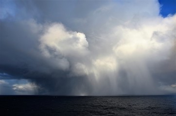 Naklejka na ściany i meble Stormy clouds over the sea