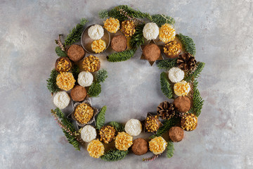 Fototapeta na wymiar Christmas wreath with chocolate truffles