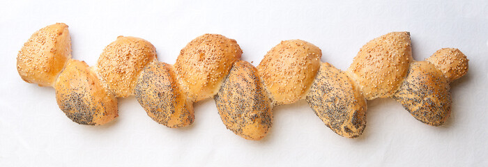 Fresh baked baguette with poppy and sesame grains