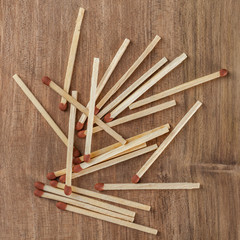 Wooden matches sticks on a wooden table background