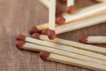 Wooden matches sticks on a wooden table background