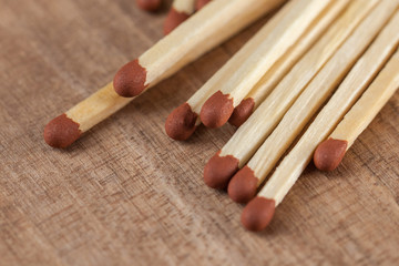 Wooden matches sticks on a wooden table background