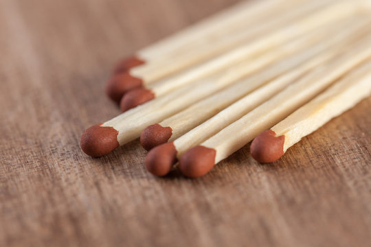 Wooden matches sticks on a wooden table background