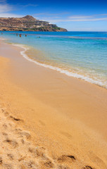 Paradise beach Myconos (Kalamopodi),Greece. Summertime.  Sunny with blue sky and crystal clear water. Paradise is definitely the most famous beach of Mykonos: thin sand and emerald green water.
