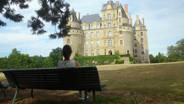 Girl makes pictures of Chateau de Brissac