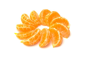 Tangerines slices (oranges, mandarins, clementines, citrus fruits) isolated on a white background.