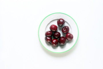 fresh cherries on a plate